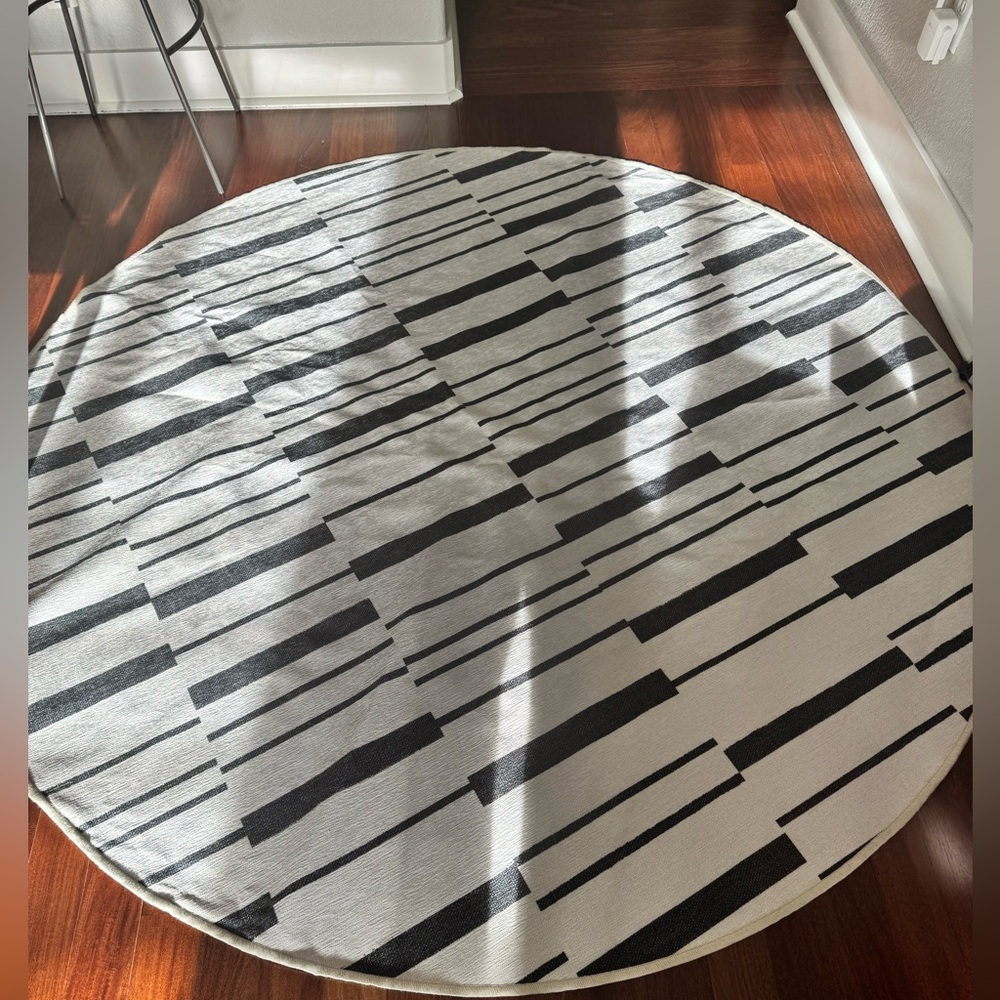 Round washable Ruggable black and white striped rug. Never used.
